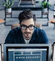 top-angle-view-male-web-designer-work_926199-3761184