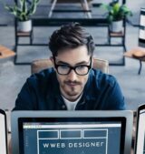top-angle-view-male-web-designer-work_926199-3761184